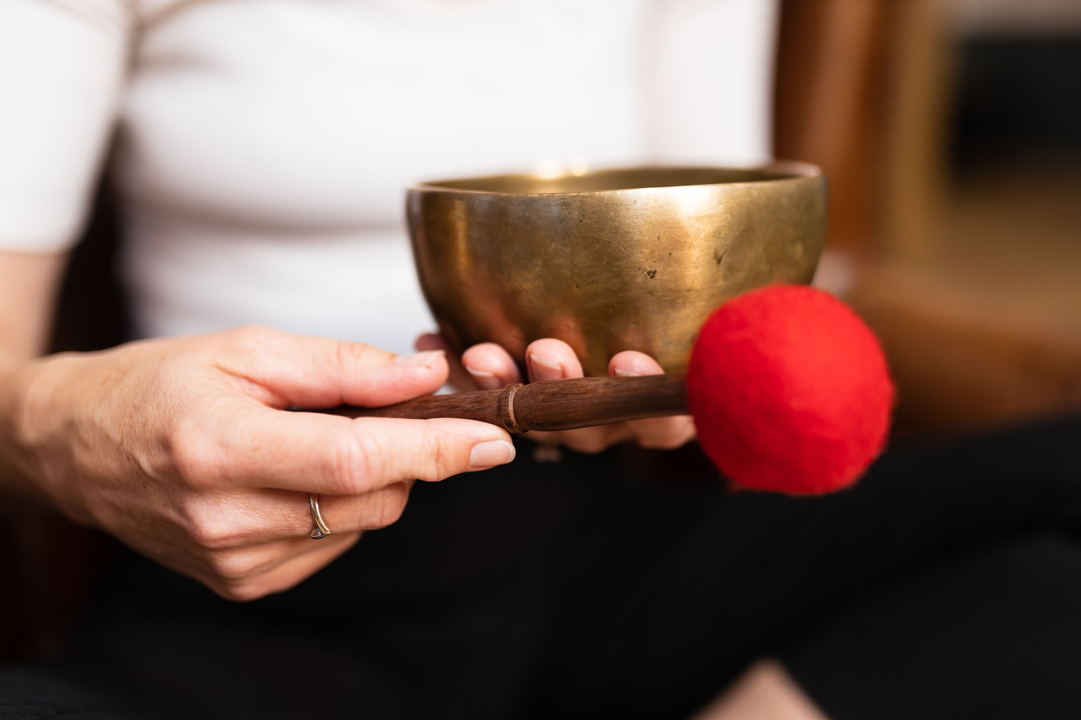 Mikala holding a singing bowl